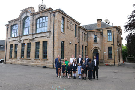 people stand outside of Bearsden school