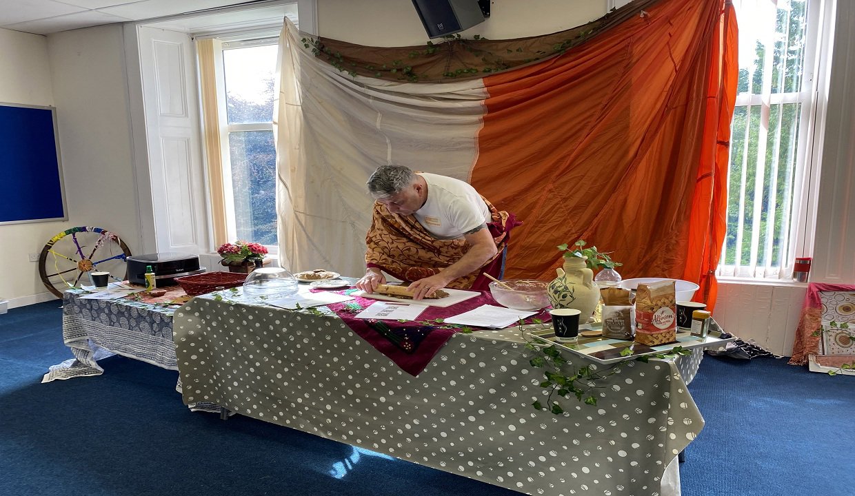 Man doing Roman cookery at Bearsden Baptist Church