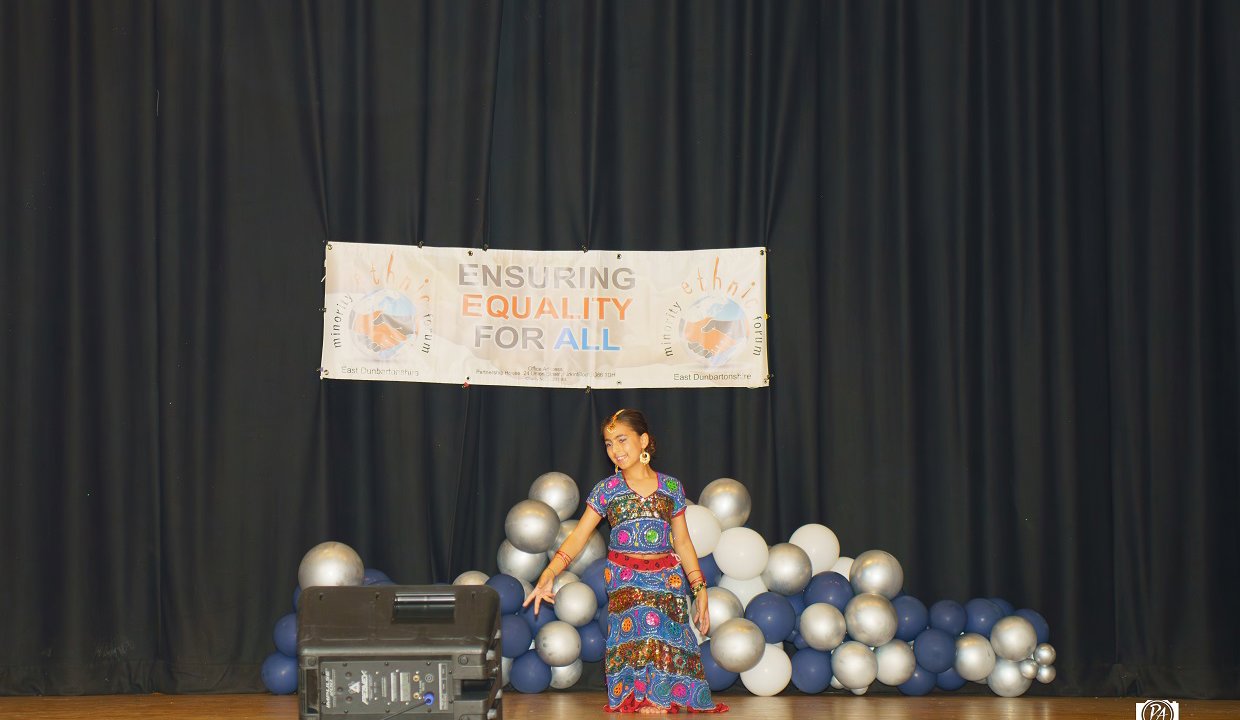 A young dancer entertains the Summer Festival crowds