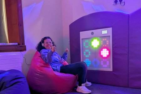 Girl sitting in a sensory room