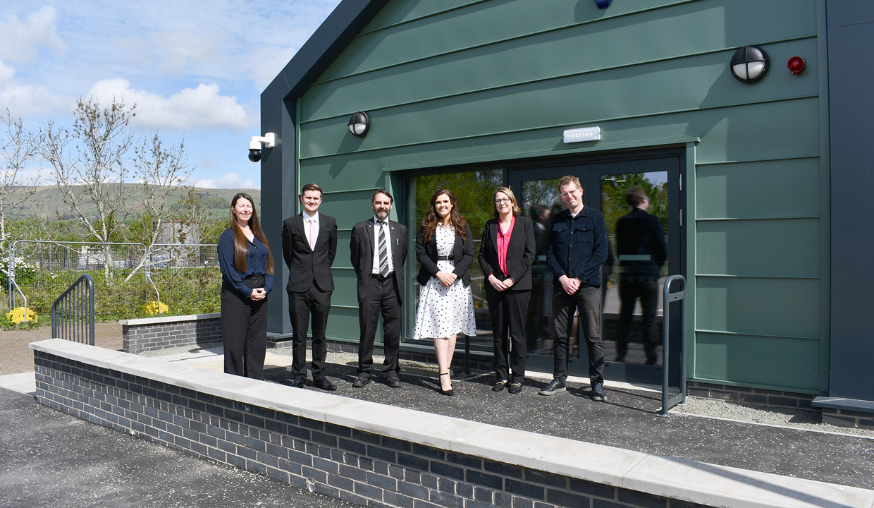outside the new centre are (from left): Victoria Proven, Site Manager – Morgan Sindall; Aidan Maguire, Project Manager – Major Assets (Council); Councillor Gordan Low – Leader of East Dunbartonshire Council; Emma Flaherty, Project Manager – Doig+Smith; Lillian McDowall, Head of Business Development – SCAPE Scotland; and Alistair Kyle, Team Leader – Regeneration and Town Centres (Council).