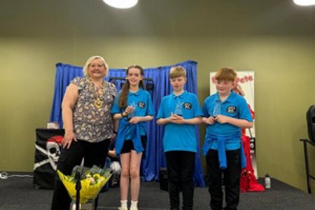 Provost is pictured with the three new Youth Ambassadors