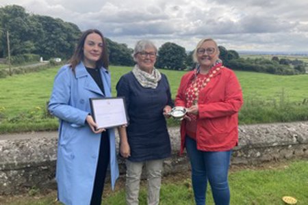 Provost Gillian Renwick and Depute Provost Colette McDiarmid with Geraldine, who accepted the Award on Paul's behalf