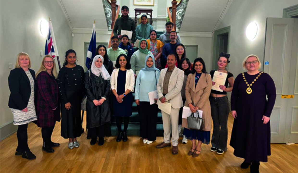 Provost Renwick pictured with new citizens at the ceremony in Kilmardinny House