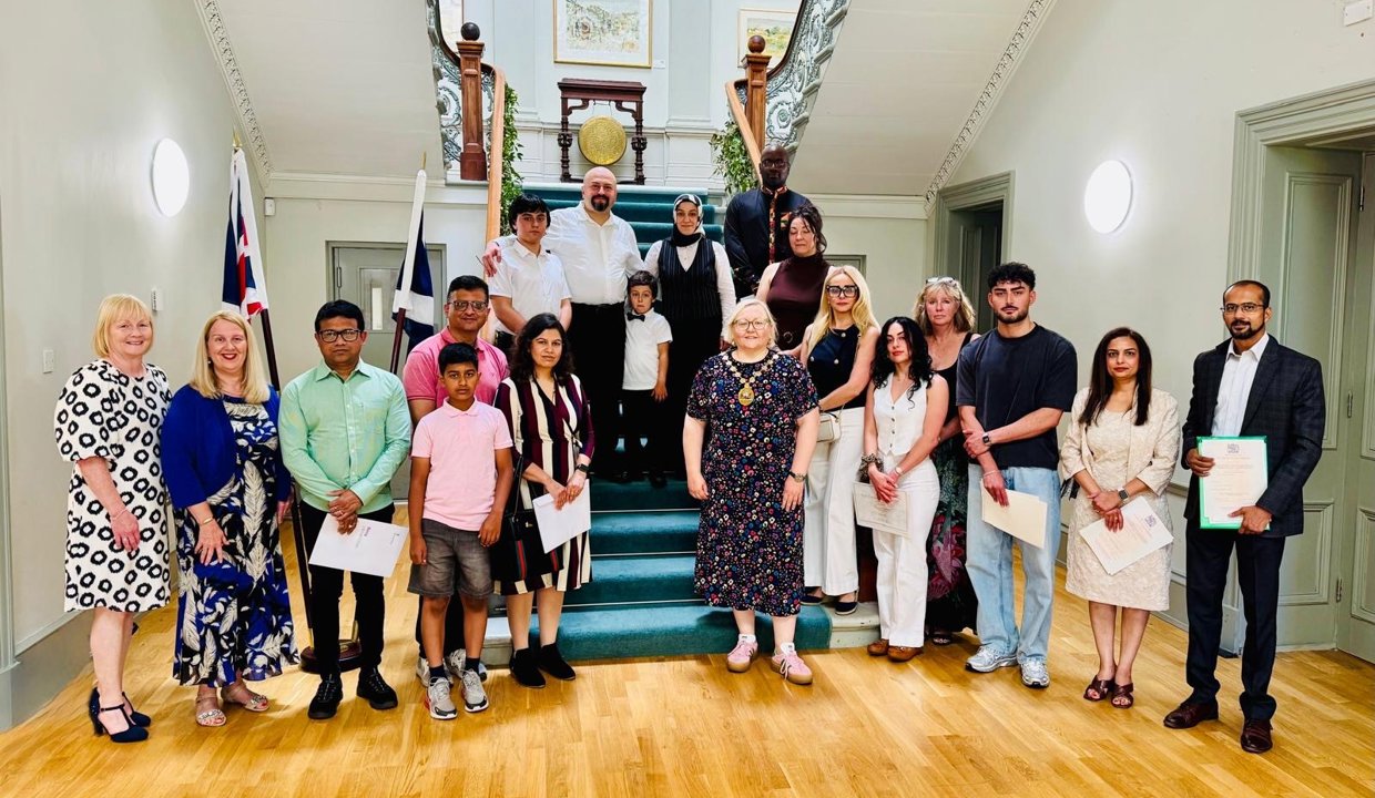 Provost Renwick with new citizens at the most recent Citizenship Ceremony.