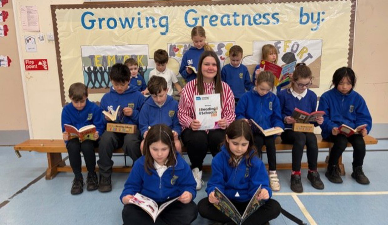 Teacher Ashleigh MacDonald with the book-loving pupils of Craigdhu Primary