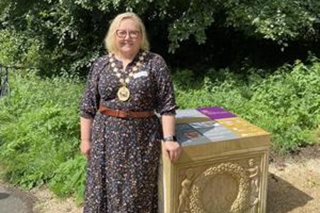 Provost stands next to part of the new installation 