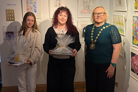 Provost Renwick with Emily and Robyn and their prizes at the exhibition
