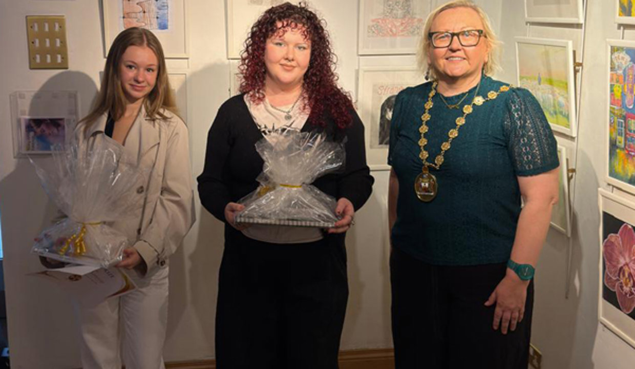 Provost Renwick with Emily and Robyn and their prizes at the exhibition