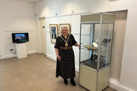 Provost Renwick with the exhibits in the Lillie Art Gallery