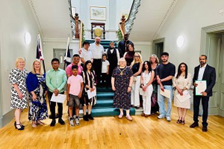 Provost Renwick with new citizens at the most recent Citizenship Ceremony.
