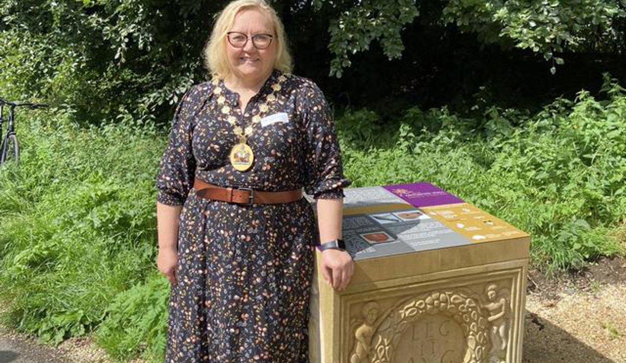 Provost stands next to part of the new installation 