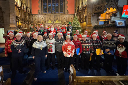 Kirkintilloch Male Voice Choir dressed in christmas jumpers and santa hats