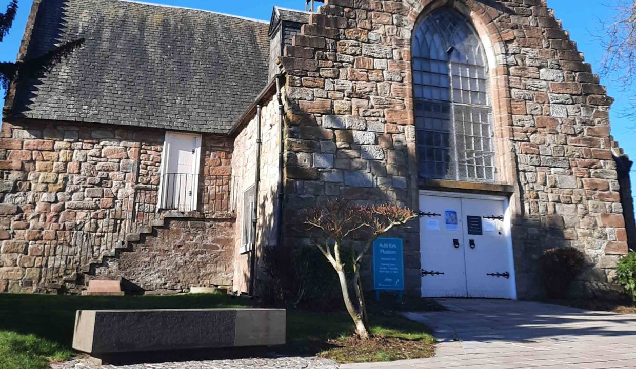 Poster with exterior photo of the Auld Kirk - containing info about the 380th Anniversary Exhibition - the 380th Anniversary Exhibition is on until 8 August 2024. The Auld Kirk Museum – Cowgate, Kirkintilloch, G66 1HN – is open Tuesday-Saturday, 10am-1pm and 2-5pm. Closed Sunday and Monday. Admission is free.