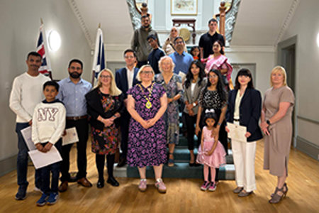 Provost Renwick with the new citizens at Kilmardinny House