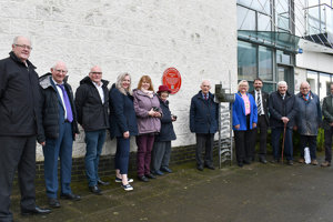 Provost Gillian Renwick and local historian and author, Don Martin MBE unveiling the red wheel plaque
