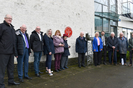 Provost Gillian Renwick and local historian and author, Don Martin MBE unveiling the red wheel plaque