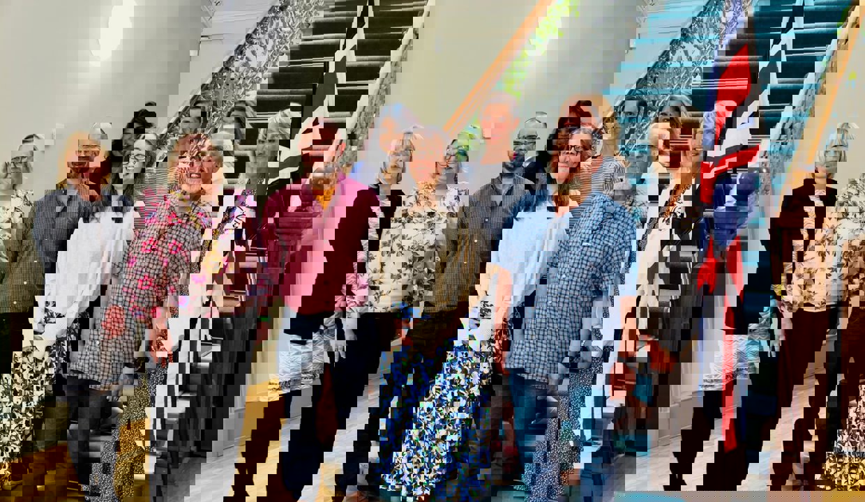 The Provost, Deputy Lord Lieutenant Margaret Stewart and those who have gained citizenship all stand and smile together 