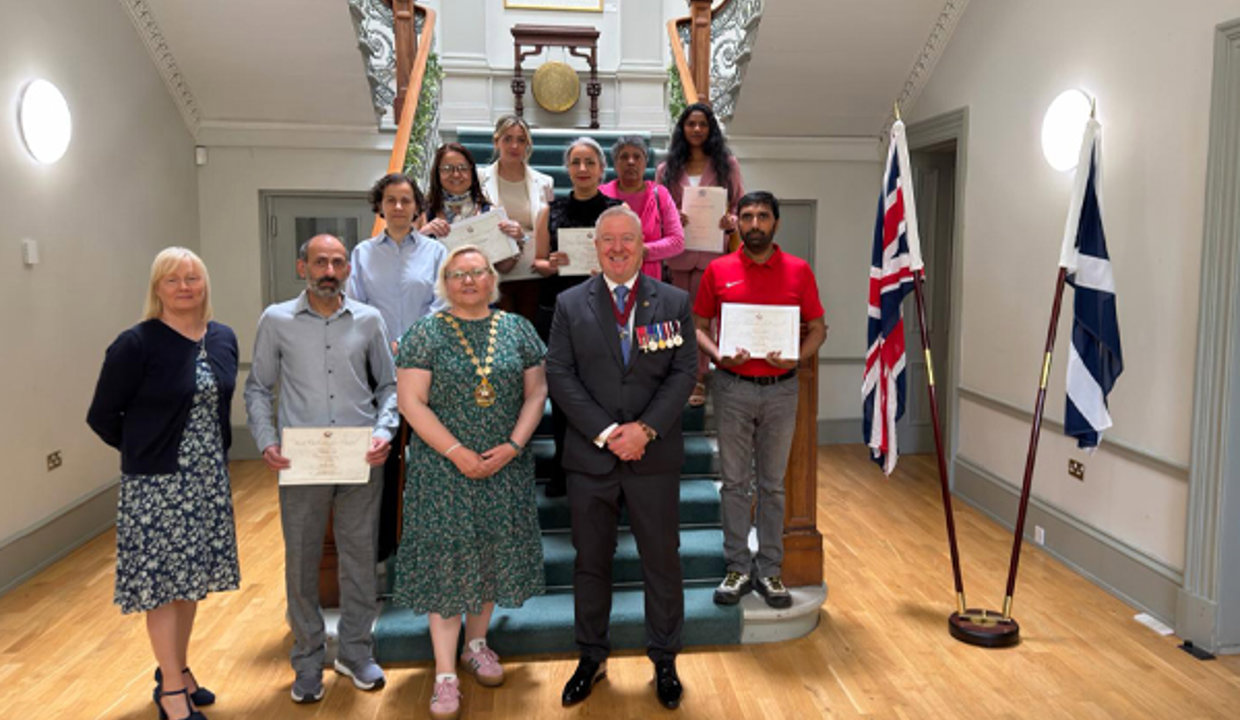 Provost Renwick at Kilmardinny House with new citizens