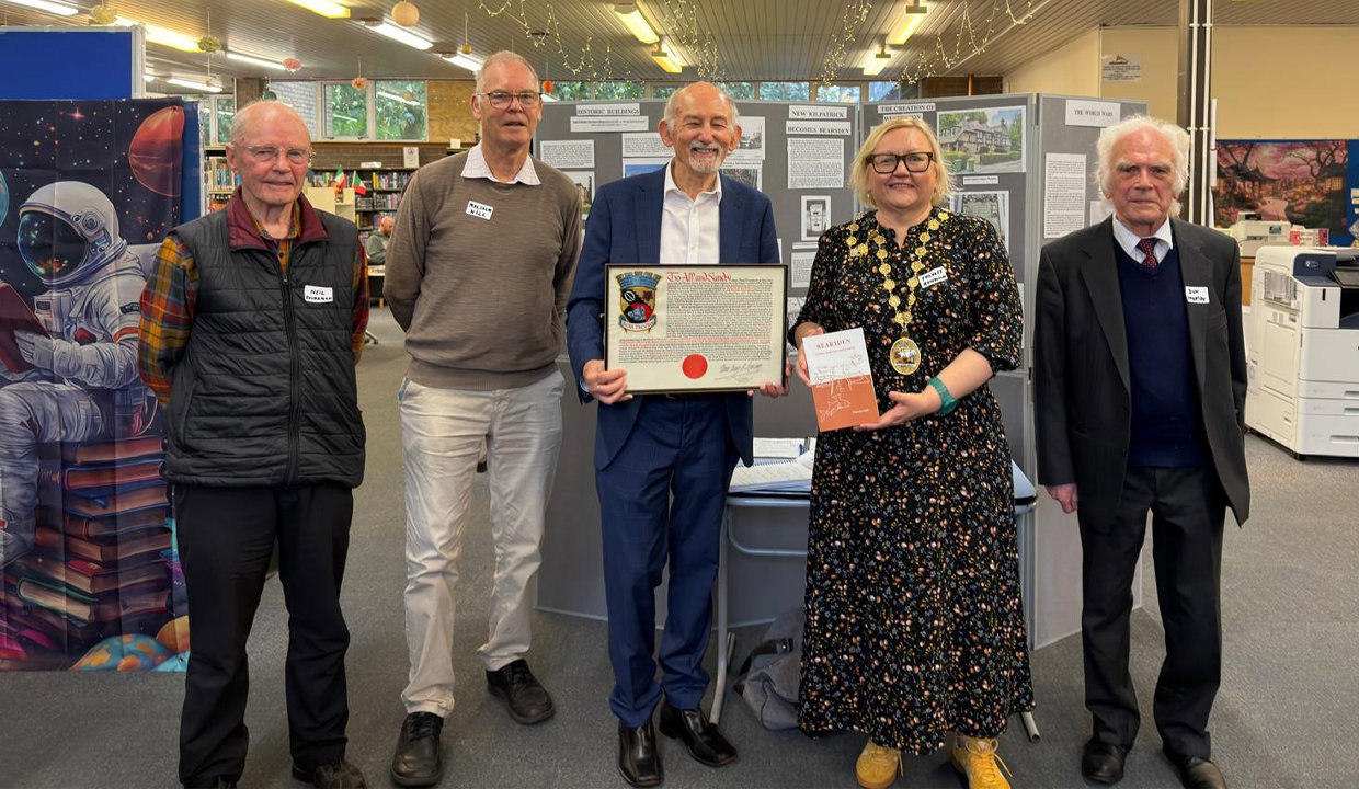 Provost Renwick is pictured with Professor Mill (second left) and members of Milngavie Heritage Group.