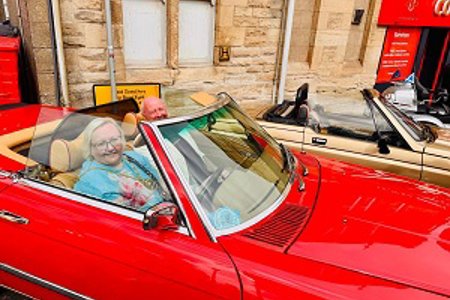Provost Renwick tries out a classic car at the BIG Weekend