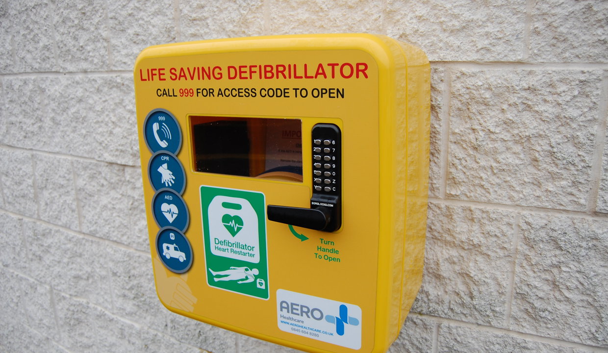 Defib machine attached to the wall at the Marina