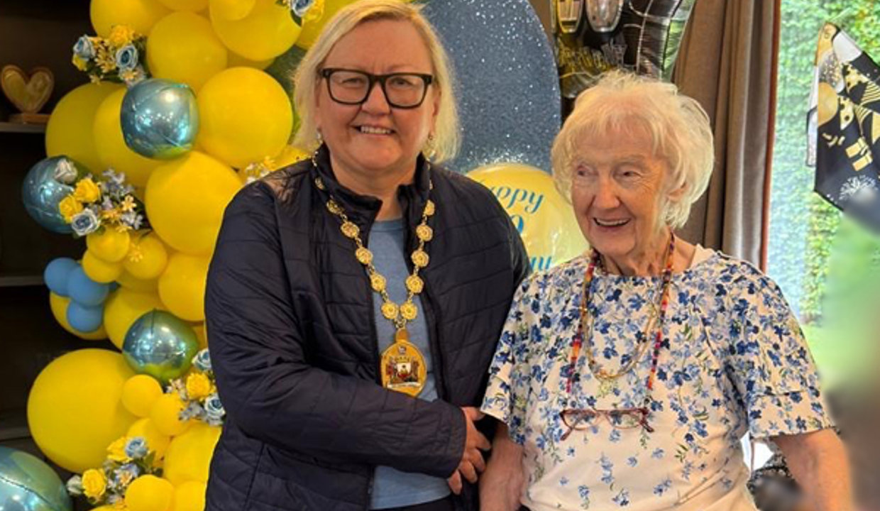 Provost with her arm around Mary celebrating her 100th birthday