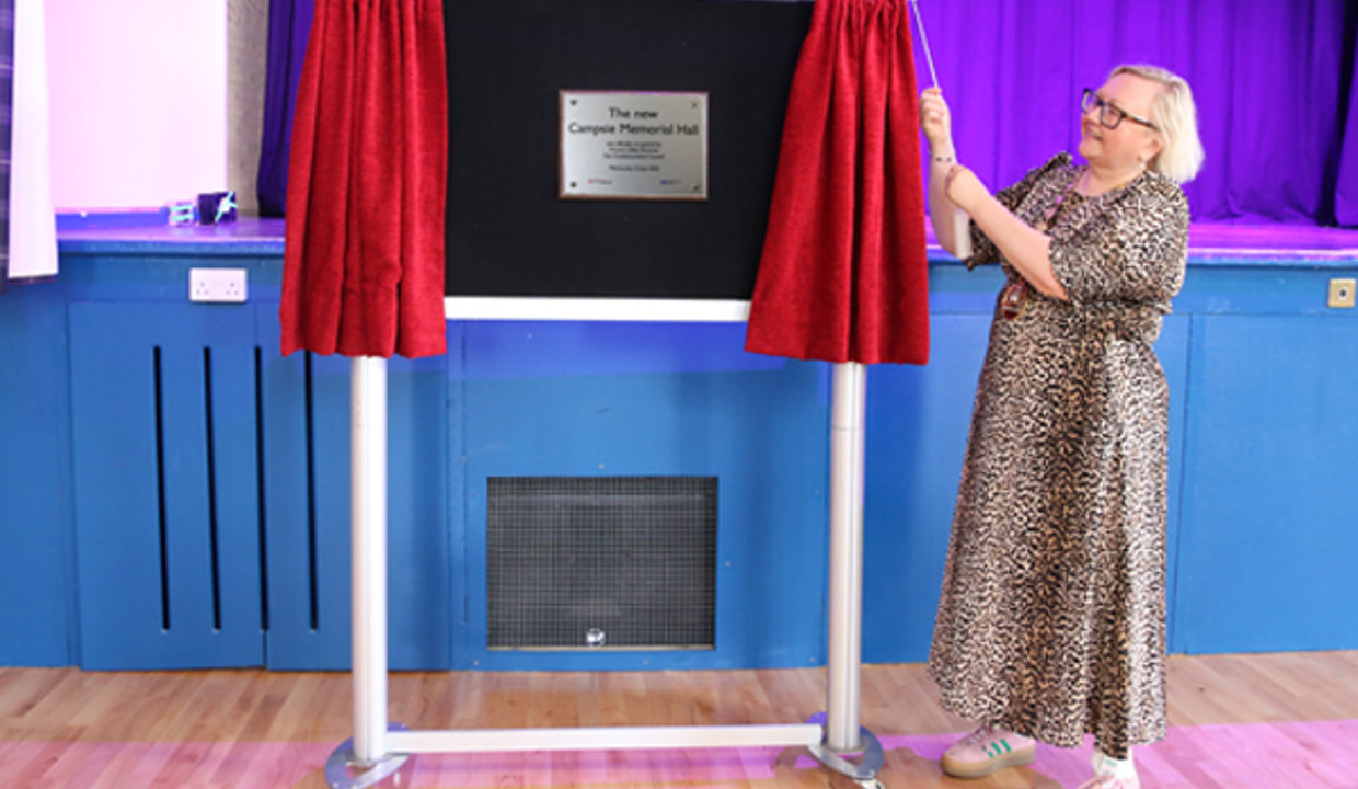 Provost Renwick unveils the commemorative plaque at the re-opening of Campsie Memorial Hall.
