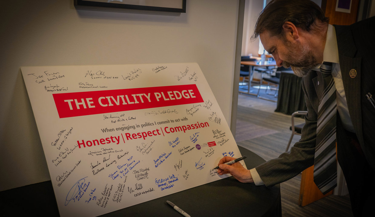 Council Leader Gordan Low has signing the pledge 