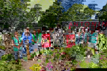 people gathered round statue